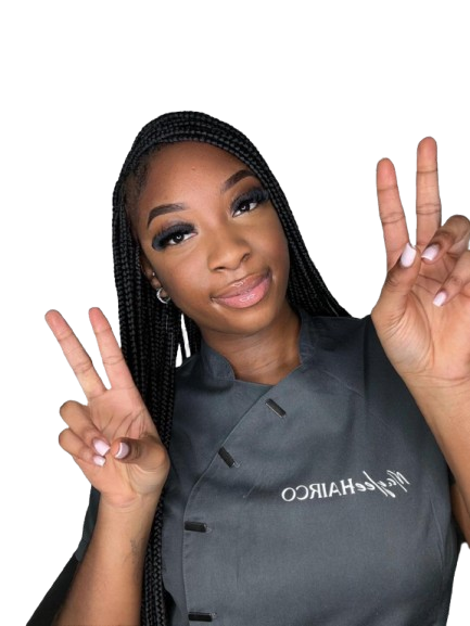 Smiling stylist showcasing her natural braids